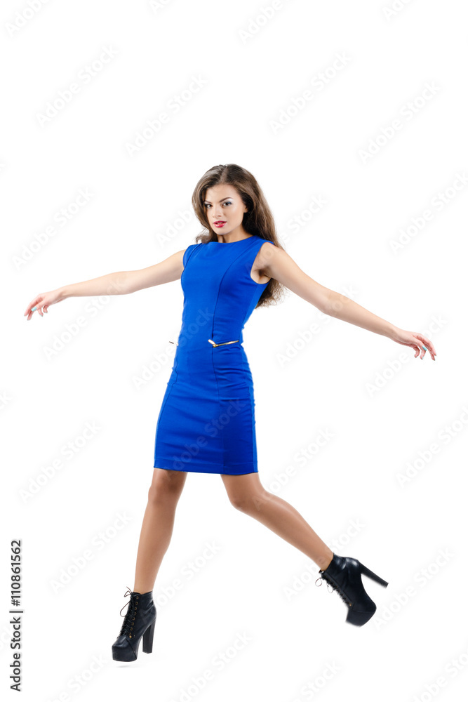 Beautiful stylish girl with long hair jumping on white background. Fashion concept. Beautiful stylish girl with long hair jumping on white background. Fashion concept.