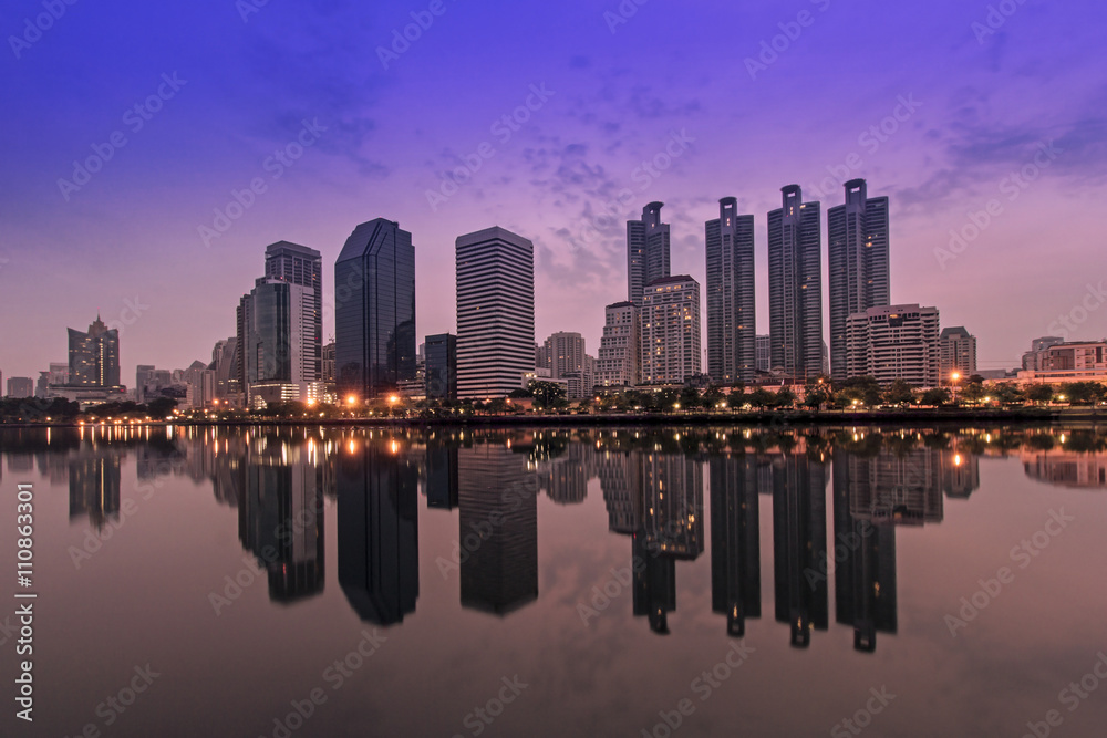 Cityscape of Benjakitti park Bangkok city downtown at sunrise wi
