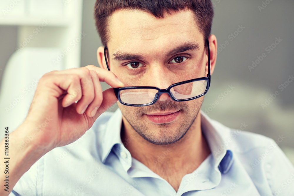 portrait of businessman in eyeglasses at office portrait of businessman in eyeglasses at office