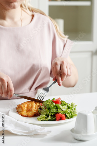 Fried beef with salad on white table. Stock image