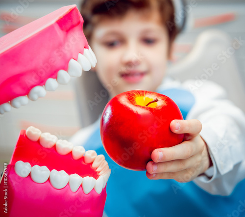 Dentures biting an apple photo