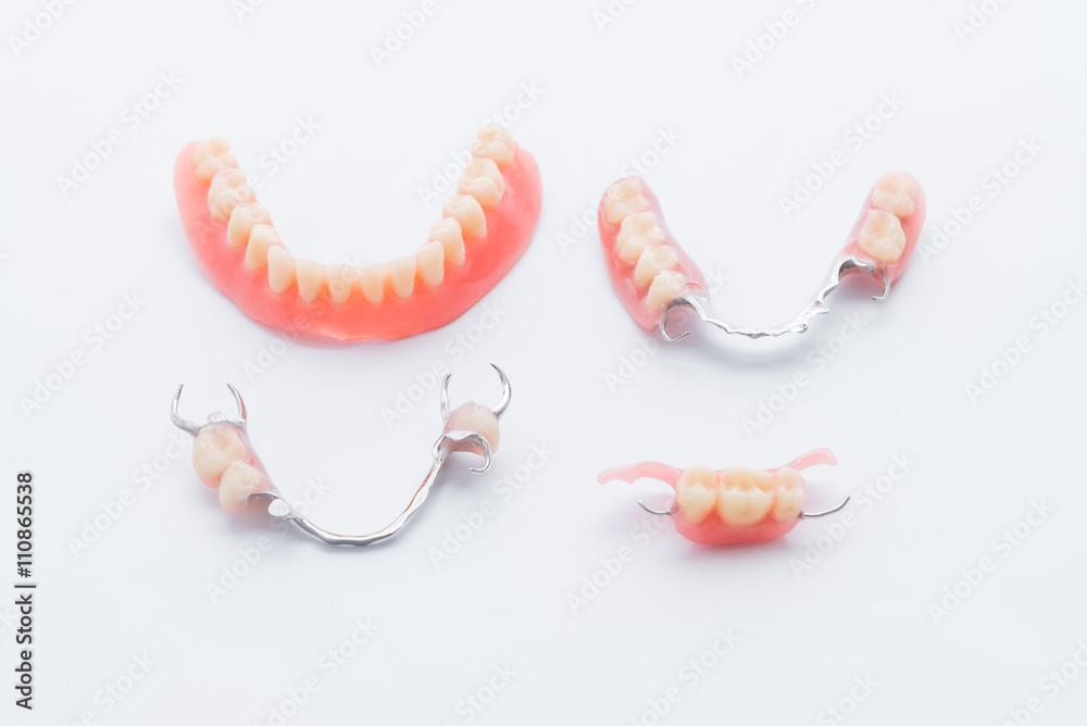 Set of dentures on white background - obrazy, fototapety, plakaty 