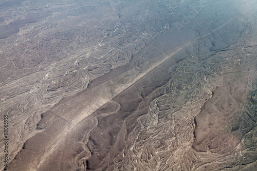 Aerial view of geoglyphs near Nazca - famous Nazca Lines, Peru. This figure is called Trapezoid.