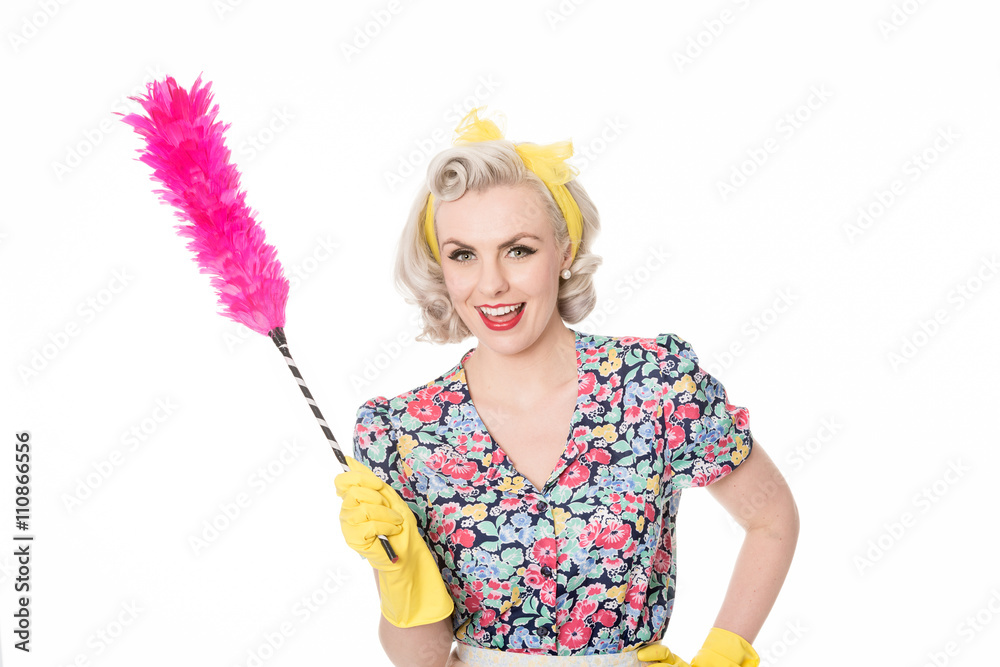 happy retro housewife, with feather duster, isolated on white happy retro housewife, with feather duster, isolated on white