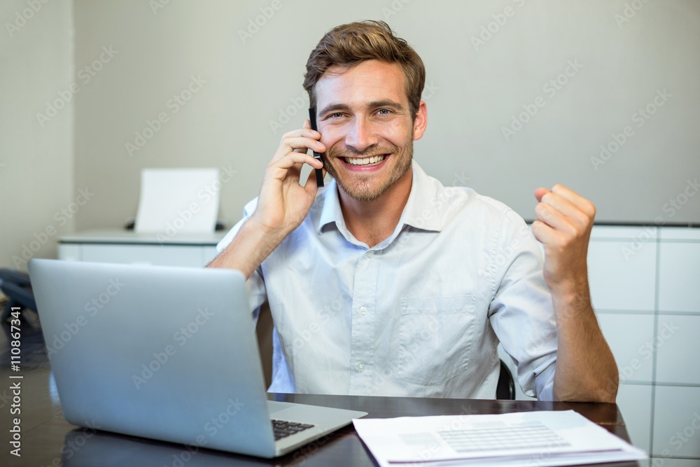 Portrait of happy businessman in office Portrait of happy businessman in office