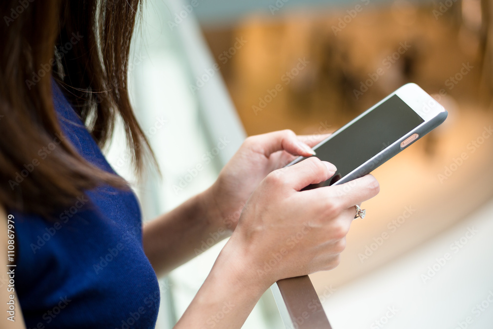 Woman using a touchscreen smartphone
