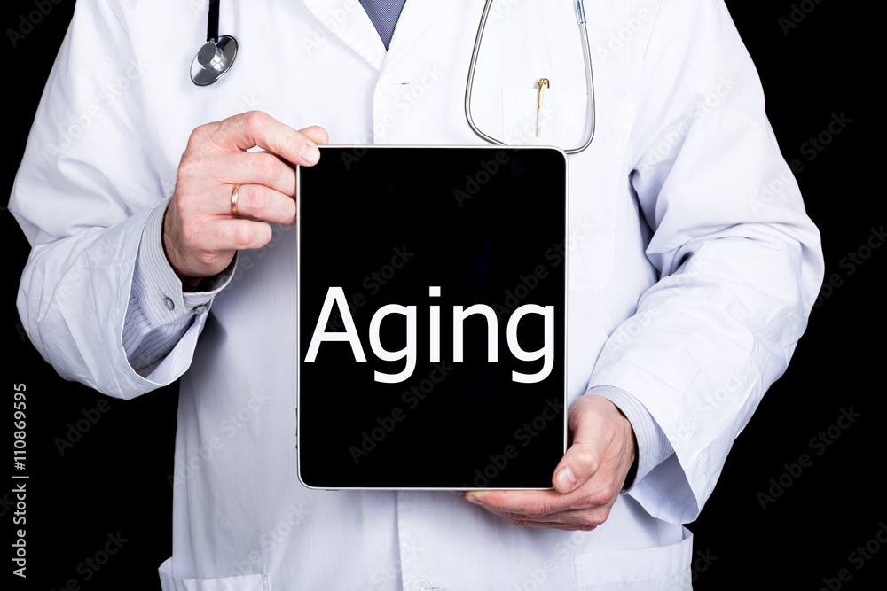 technology, internet and networking in medicine concept - Doctor holding a tablet pc with aging sign. Internet technologies in medicine technology, internet and networking in medicine concept - Doctor holding a tablet pc with aging sign. Internet technologies in medicine
