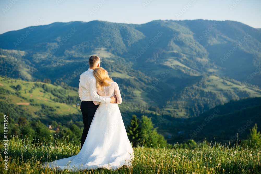 Young love couple celebrating a wedding in the mountains