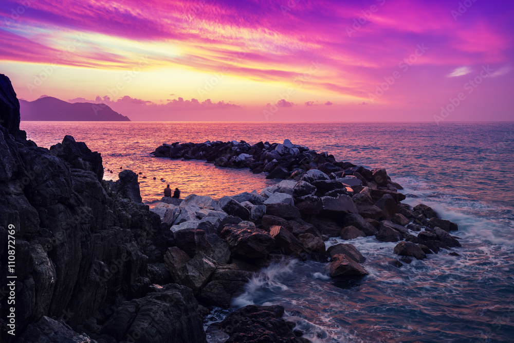 Sunset over rocky coast 