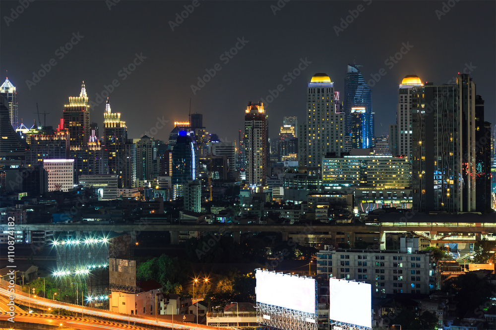 Scene of high-rise buildings and sky train railway at dusk Scene of high-rise buildings and sky train railway at dusk