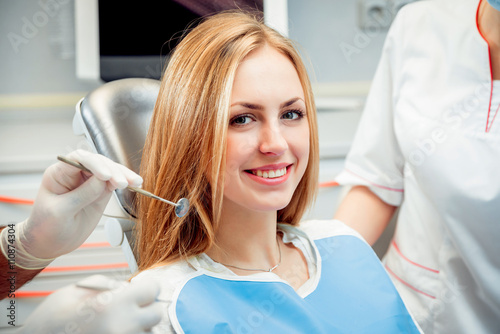 Young smiled woman at the dental office
