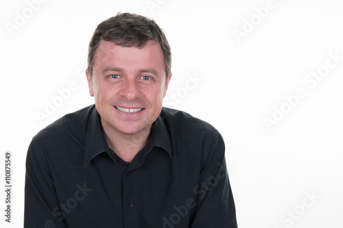 Smiling portrait of cheerful guy with blue eyes © OceanProd