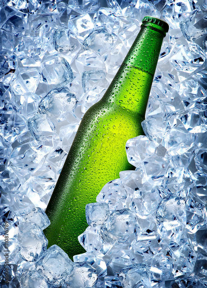 Green bottle in ice