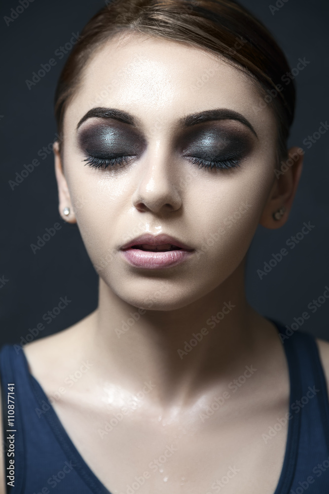 Dark and dramatic makeup on model. Dark and dramatic makeup on model.