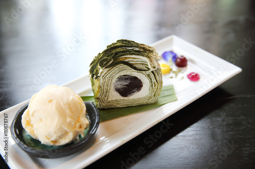 green tea roll cake with ice cream photo