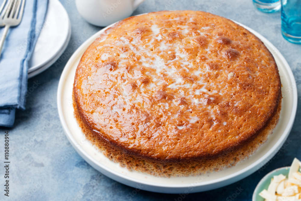 Three milk cake, tres leches cake with coconut. Traditional dessert of Latin America