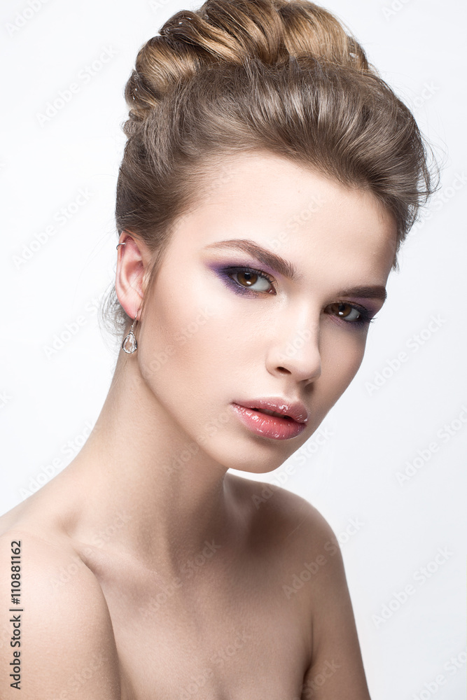 Beautiful girl in an image of bride with a bundle of hair and gentle makeup Beautiful girl in an image of bride with a bundle of hair and gentle makeup