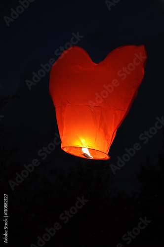 Red heart-shaped chinese lantern in the  sky