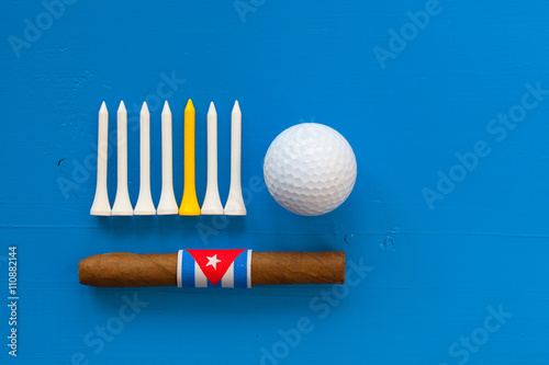 Detail of luxury Cuban cigars and golf equipments