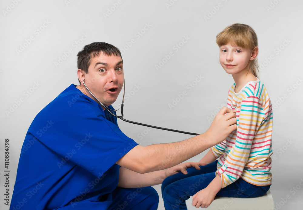 Fototapeta premium pediatrician examines a child