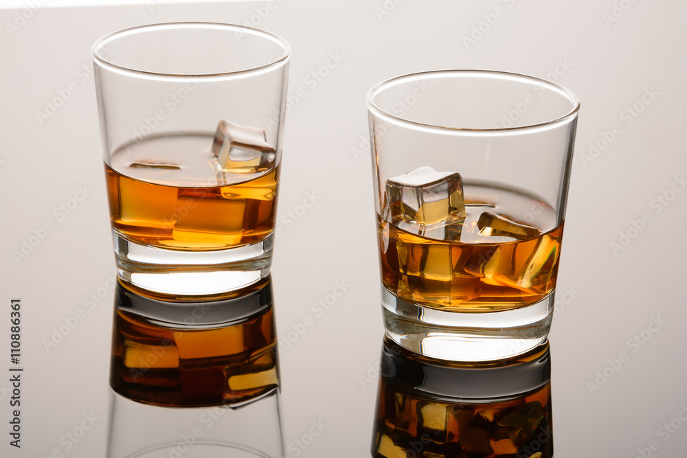 Two glasses of whiskey on the rocks