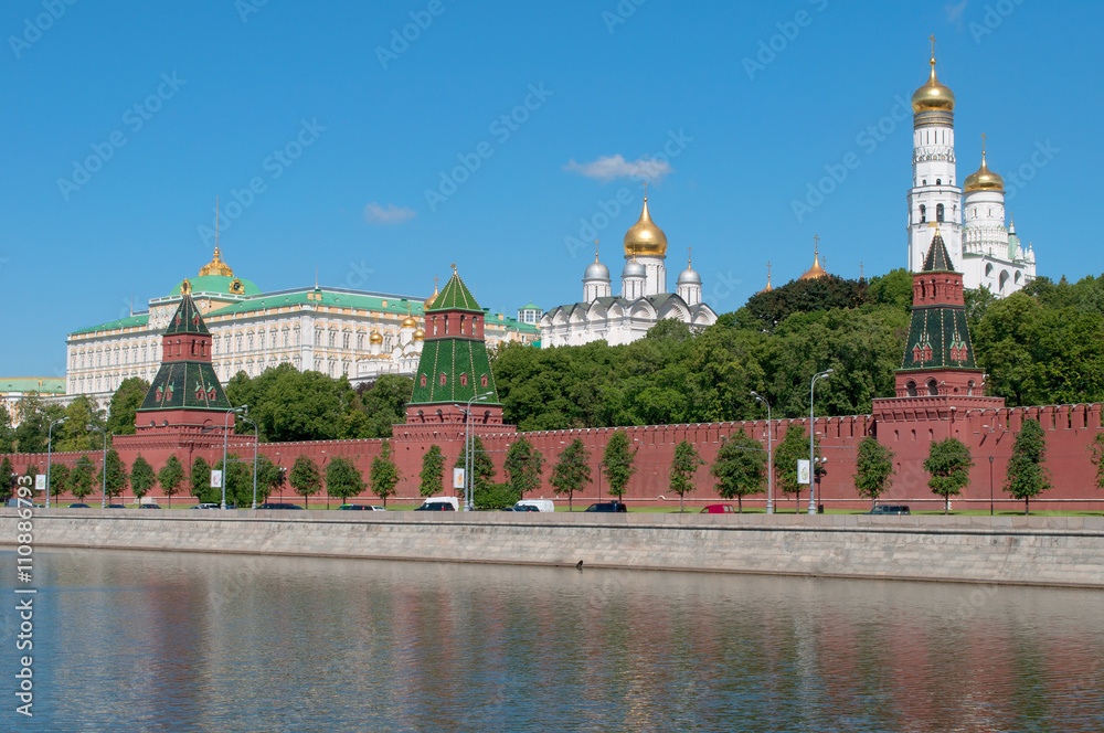 Kremlin embankment and tower of the Moscow Kremlin on a sunny june day, Russia