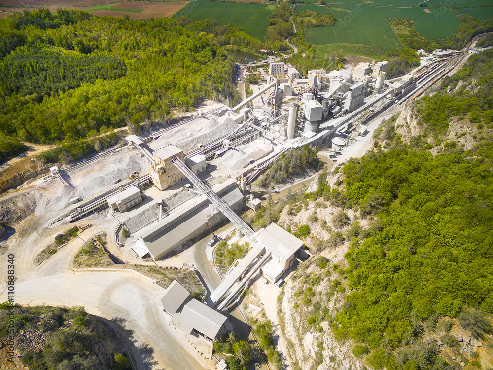 Aerial view of old lime works. Biggest Czech limestone quarry Devil's Stairs - Certovy Schody. Aerial view of industrial landscape after mining. Industry and environment in Czech Republic, Europe. 