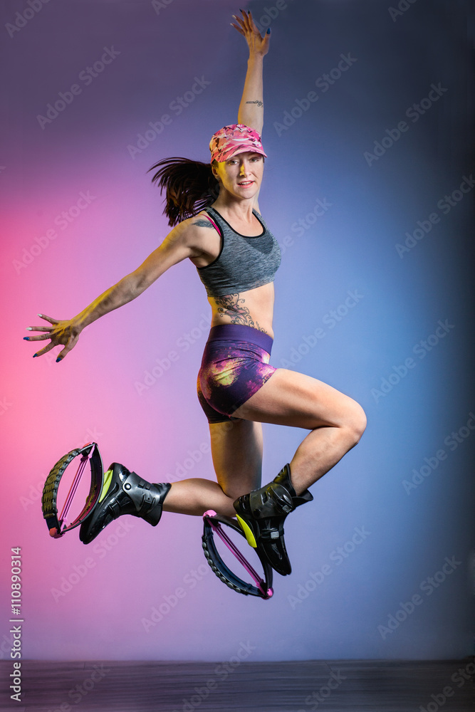 woman exercising and jumping with kangoo jumps shoes