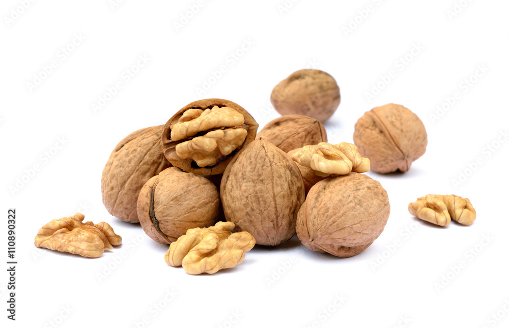 Fresh walnut with a shell isolated on white background Fresh walnut with a shell isolated on white background