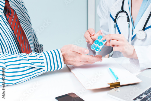 The patient and his doctor in medical office photo