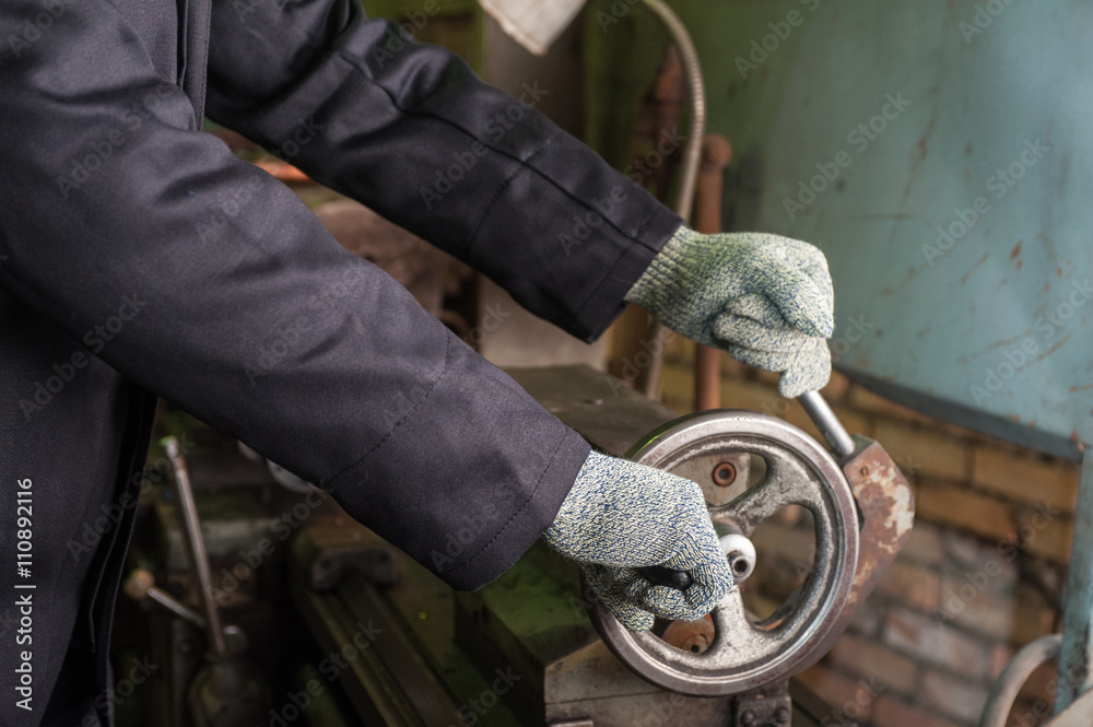worker in protective gloves