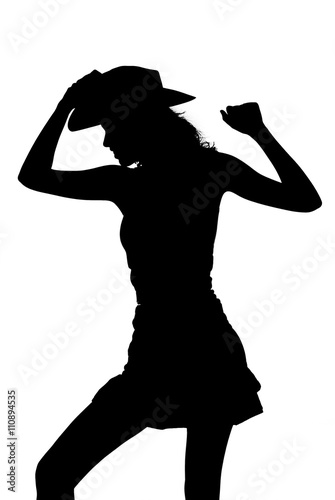 silhouette of a cowgirl dancing and posing
