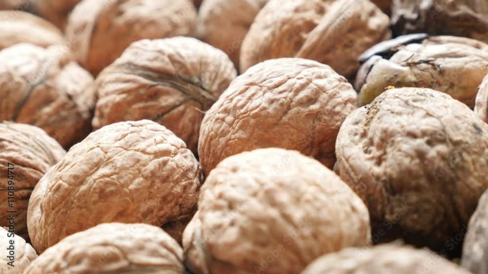 Walnuts arranged on the table slow panning 4K 2160p 30fps UltraHD video - Raw food background of walnut in the shell 4K 3840X2160 UHD pan footage Walnuts arranged on the table slow panning 4K 2160p 30fps UltraHD video - Raw food background of walnut in the shell 4K 3840X2160 UHD pan footage