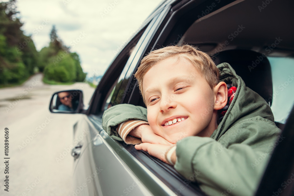 Dreaming boy look out from the car window Dreaming boy look out from the car window