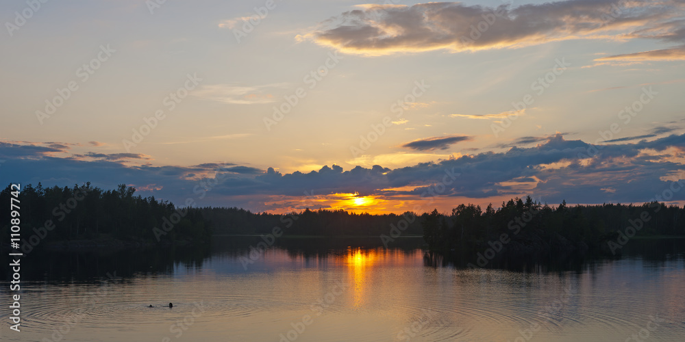 summer sunset on forest lake