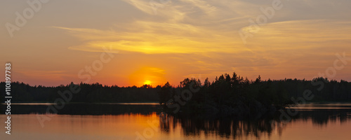 sunset on forest lake