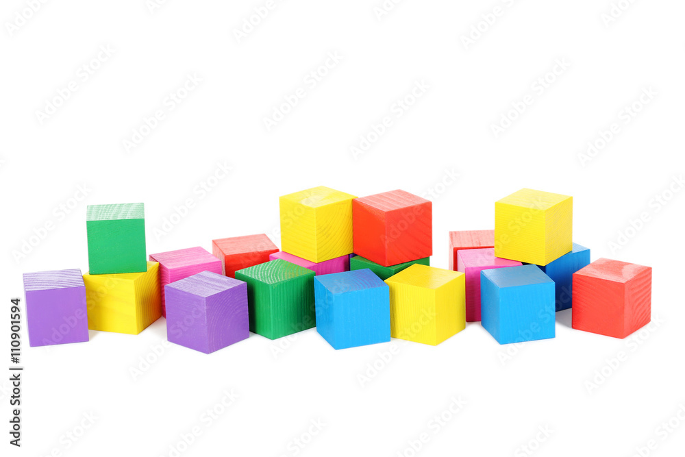 Colorful wooden toy cubes isolated on a white Colorful wooden toy cubes isolated on a white