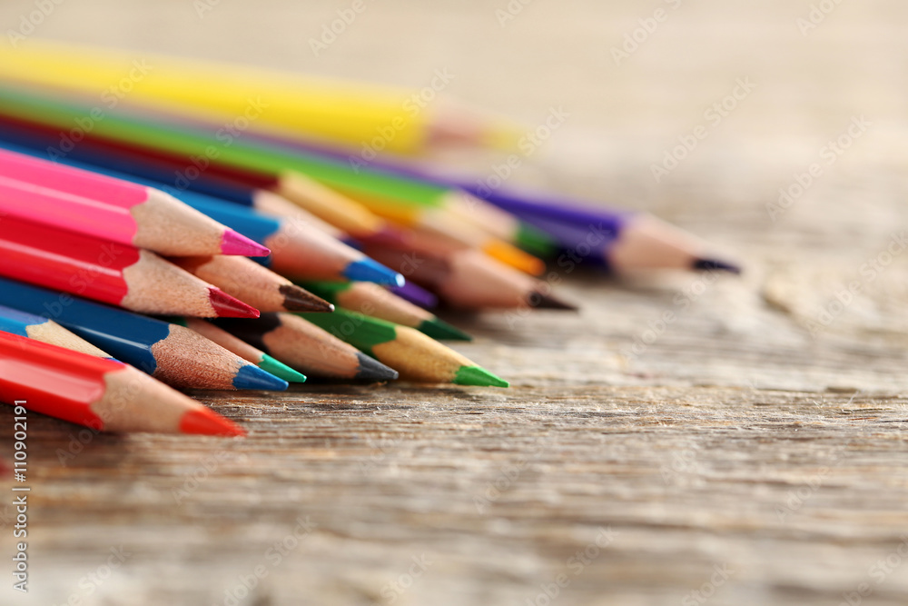 Drawing colourful pencils on a wooden background Drawing colourful pencils on a wooden background