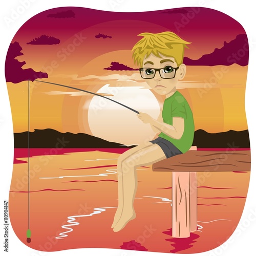 Little sad nerd boy fishing on lake sitting on a wood pontoon at sunset