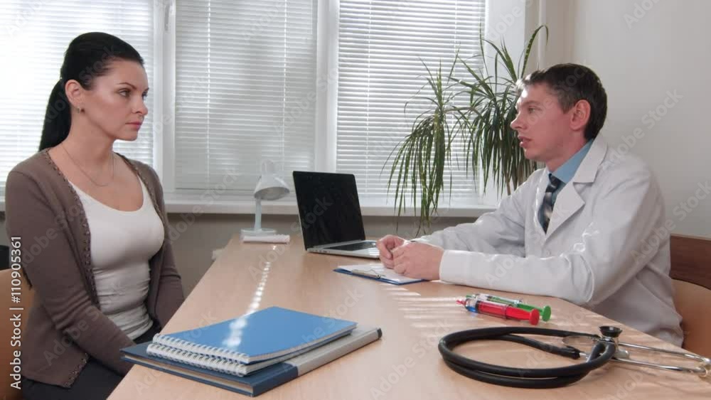 Male doctor consultate female patient handshake Male doctor consultate female patient handshake