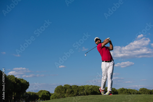 golf player hitting long shot