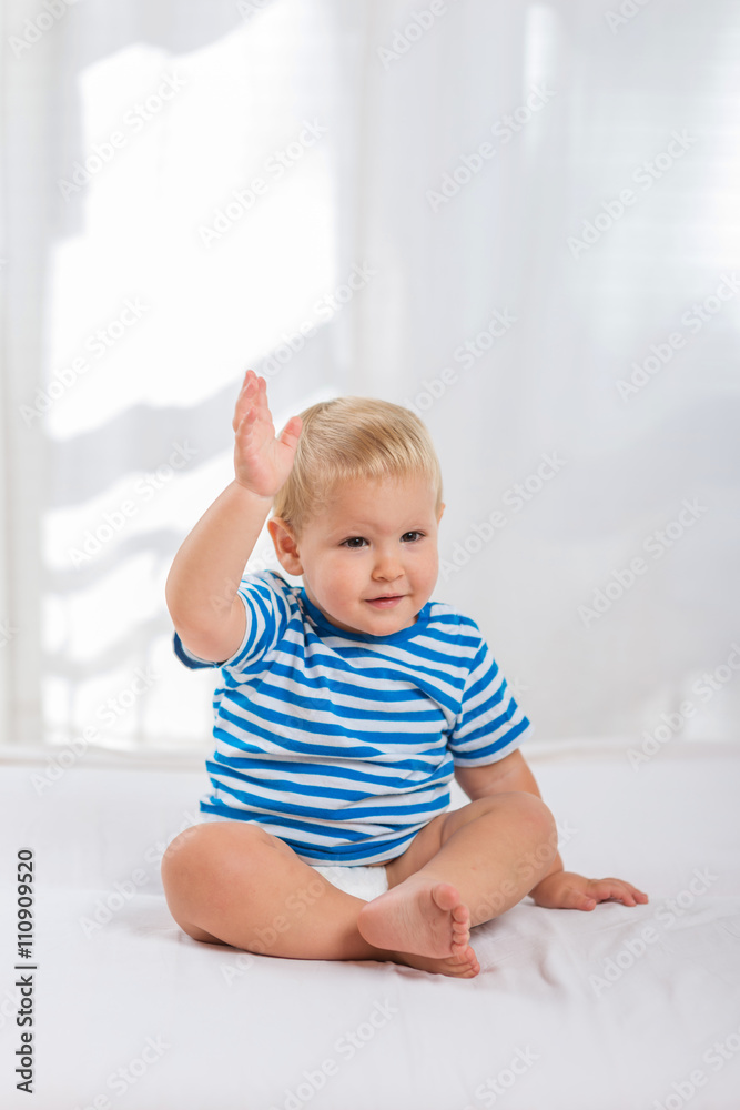 Happy baby smiling and waving hand Happy baby smiling and waving hand