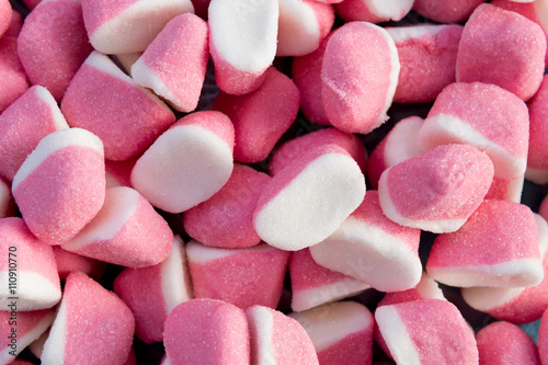 Collection of white and pink gummy candies