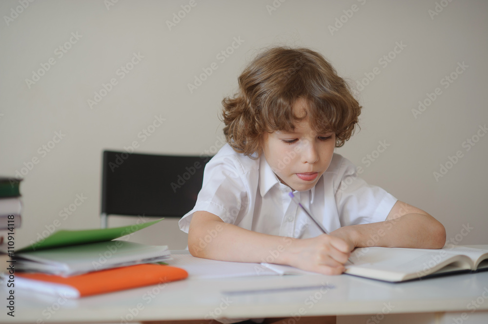 Student elementary school diligently doing homework Student elementary school diligently doing homework