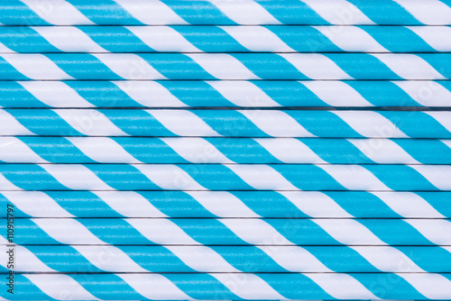 Pattern of blue striped paper straws.