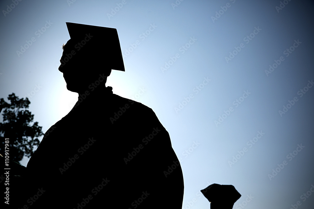 graduate walks during commencement ceremony.
