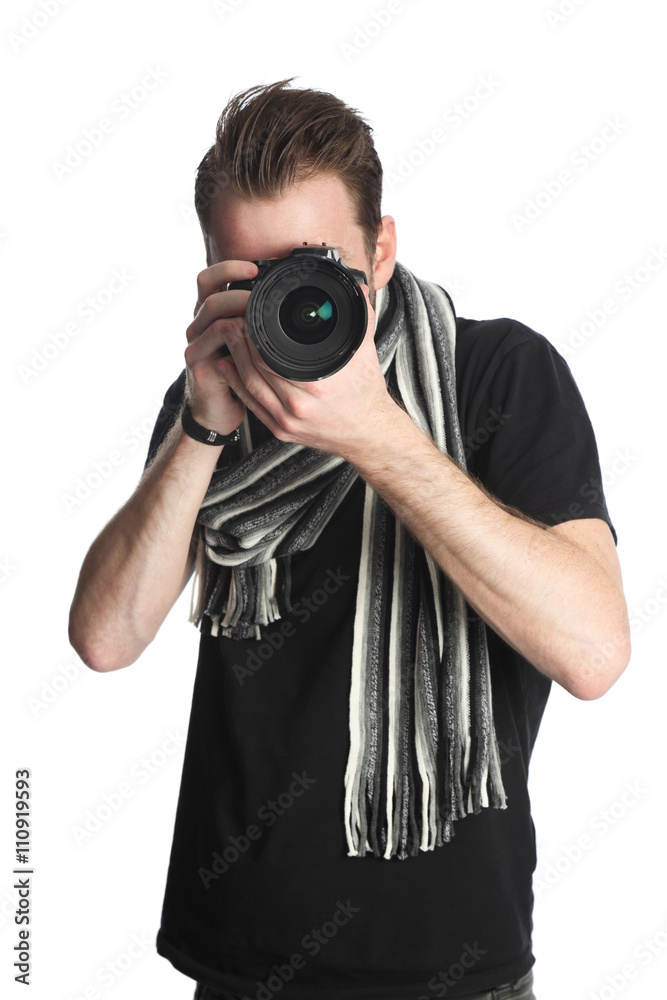 Attractive photographer with a digital slr camera, wearing a black tshirt, scarf and jeans. Standing against a white background. Attractive photographer with a digital slr camera, wearing a black tshirt, scarf and jeans. Standing against a white background.