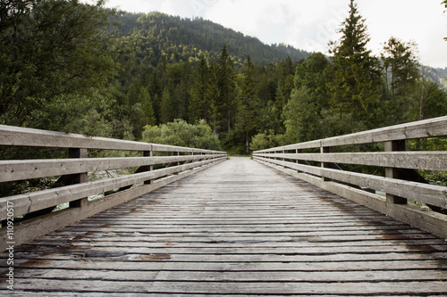 Wooden footbridge, Sylvensteinspeicher, Bavaria, Germany photo