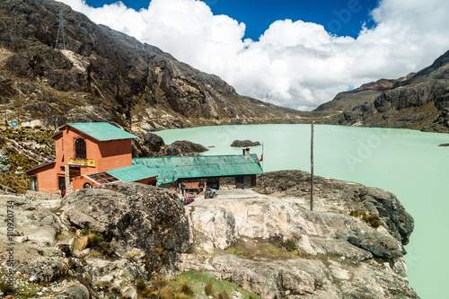 View of mountain refuge Huayna Potosi Refugio by Zongo dam lake, in the altitude of 4700m. photo