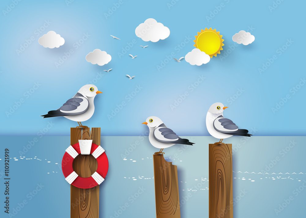 Fototapeta premium Seagull standing on a wooden post